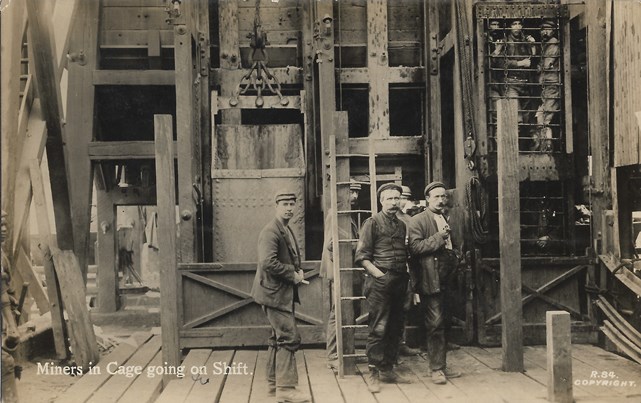 Miners in Cage going on Shift.